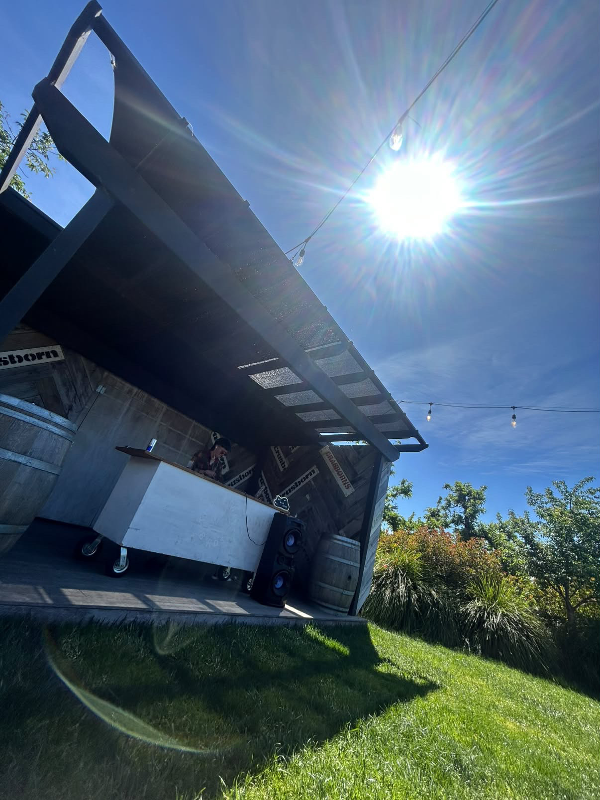 Outdoor daytime DJ booth in the sun